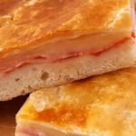 Storia e ricetta della parigina, una pizza rustica napoletana
